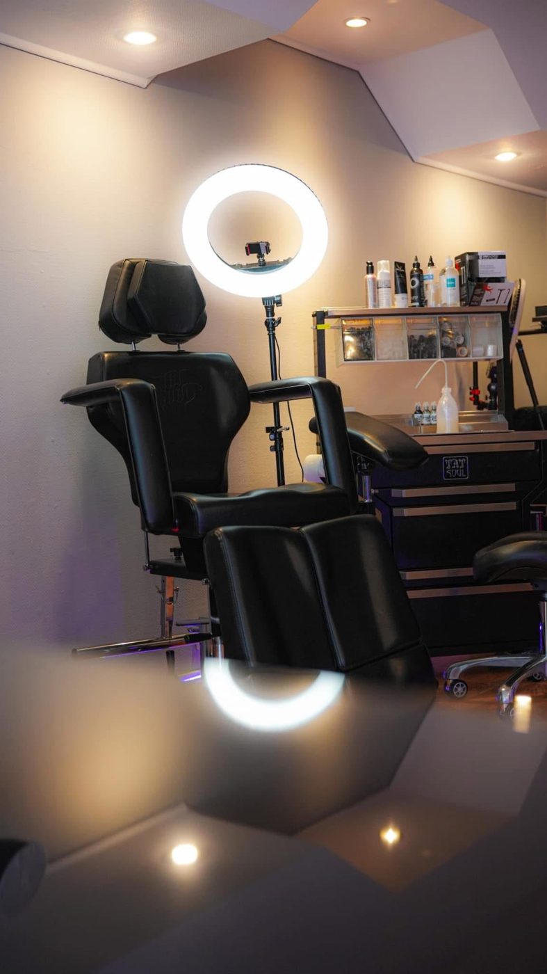 A tattoo workstation with ring light in the Success Ink studio